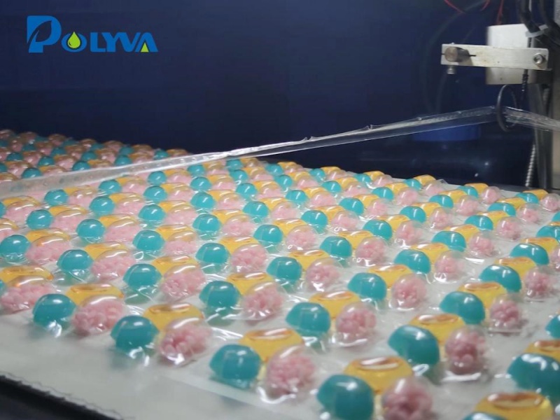 Polyva high-speed laundry pods packaging machine is producing new powder-liquid mixing cavity laundry capsules.This kind of mixed pods added with solid fragrance beads can achieve long-lasting fragrance after While cleaning clothes.